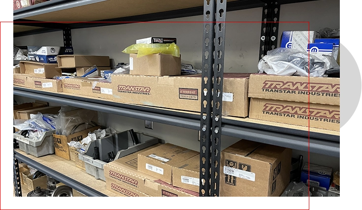 A shelf with boxes and other items on it.